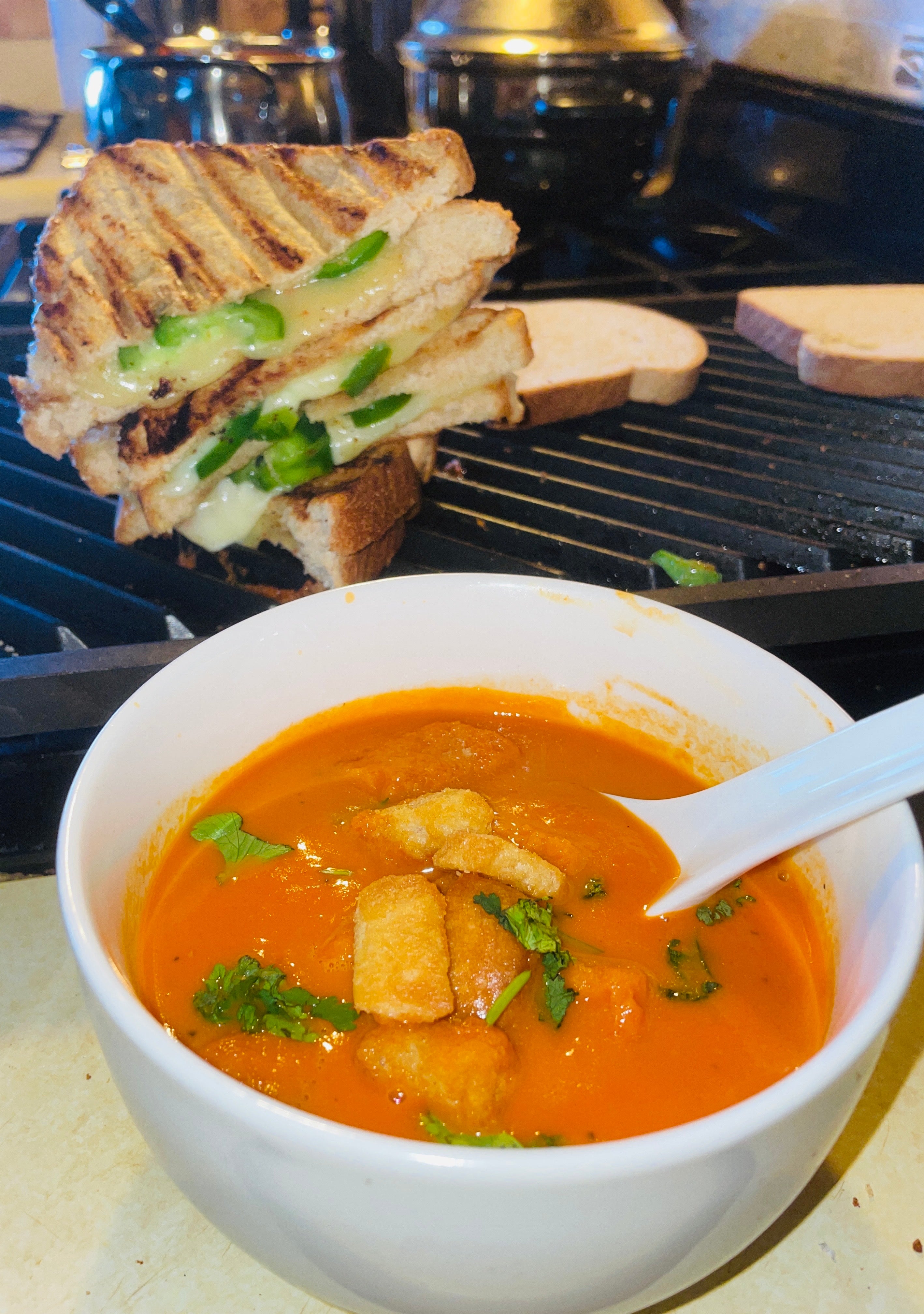 A vegan grilled cheese sandwich served with jalapeno's